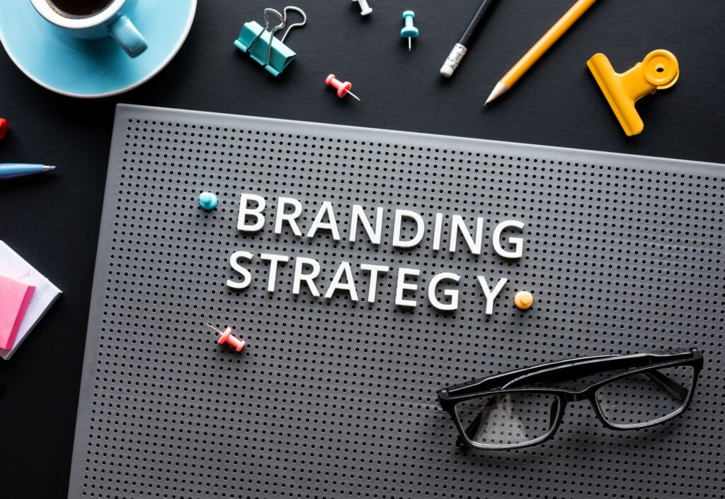 Branding strategy text on modern desk sparks business creativity.
